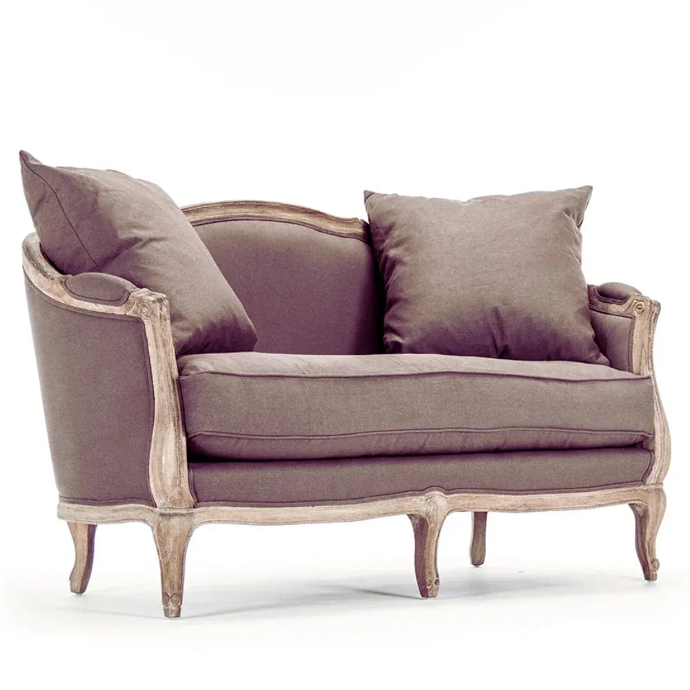 French country loveseat with distressed wood frame and taupe upholstery, perfect for shabby chic or farmhouse decor