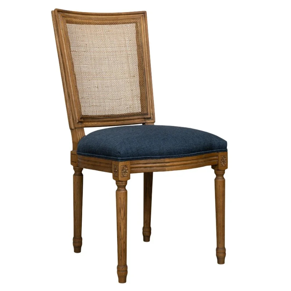 French country cane back chair with navy upholstered seat and carved wood legs