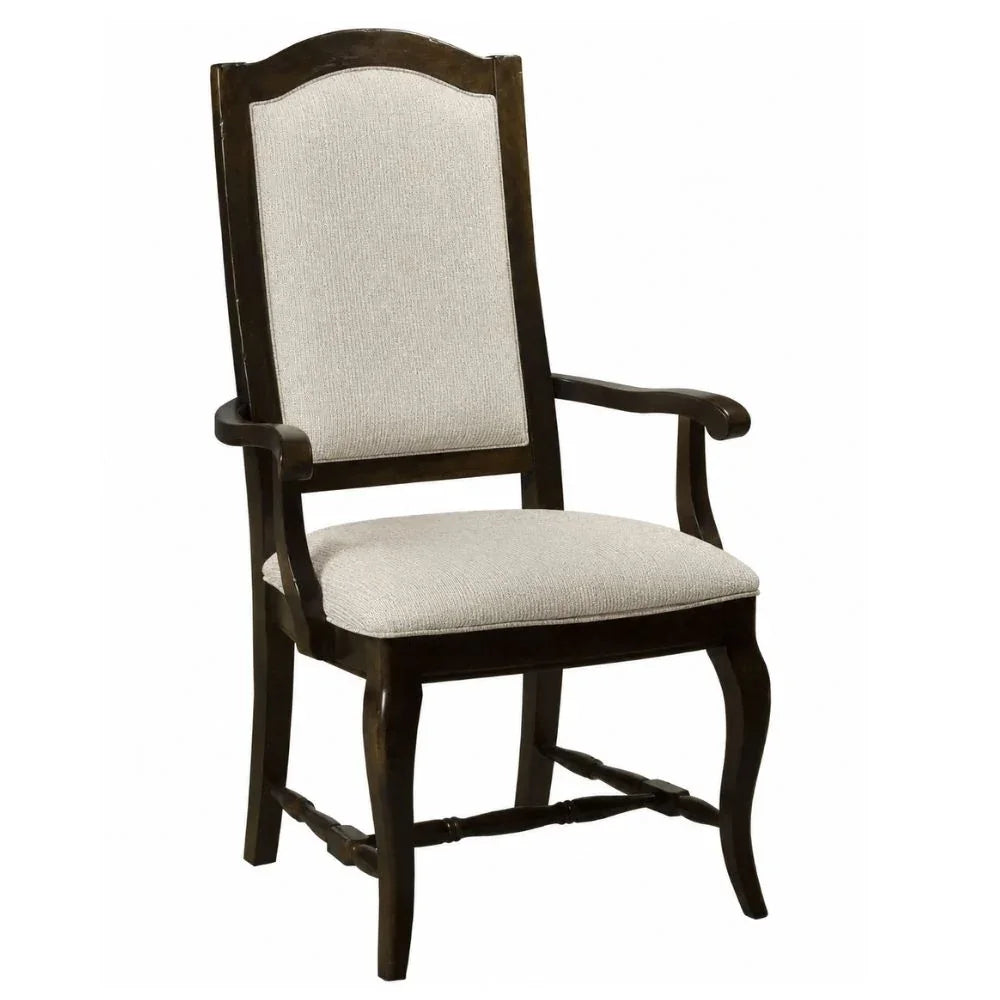 French country armchair with dark wood frame and beige upholstered seat and back