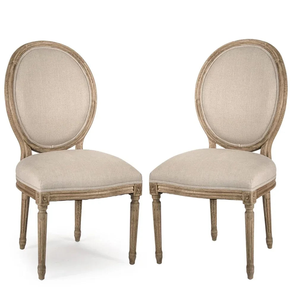 French country dining chairs with oval back, beige upholstery, and distressed wood finish