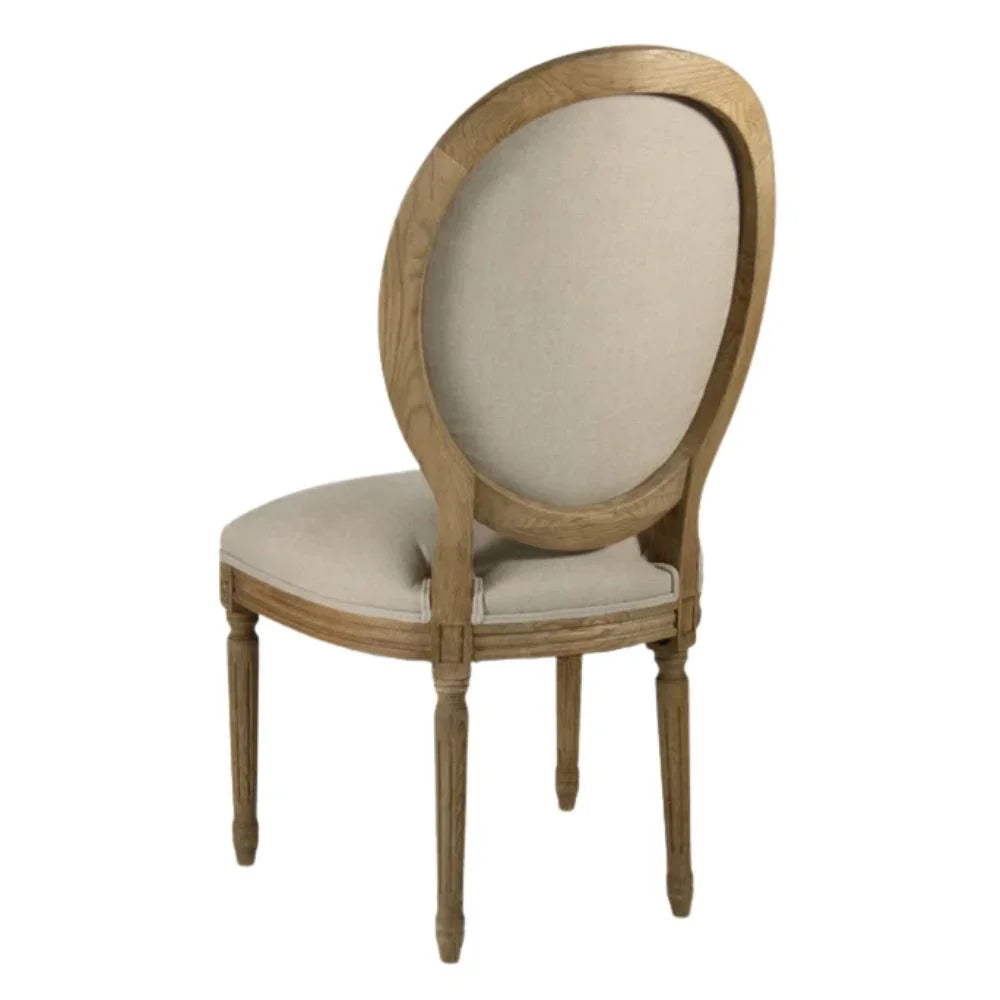 French country dining chair with oval back, light wood frame, and beige upholstery