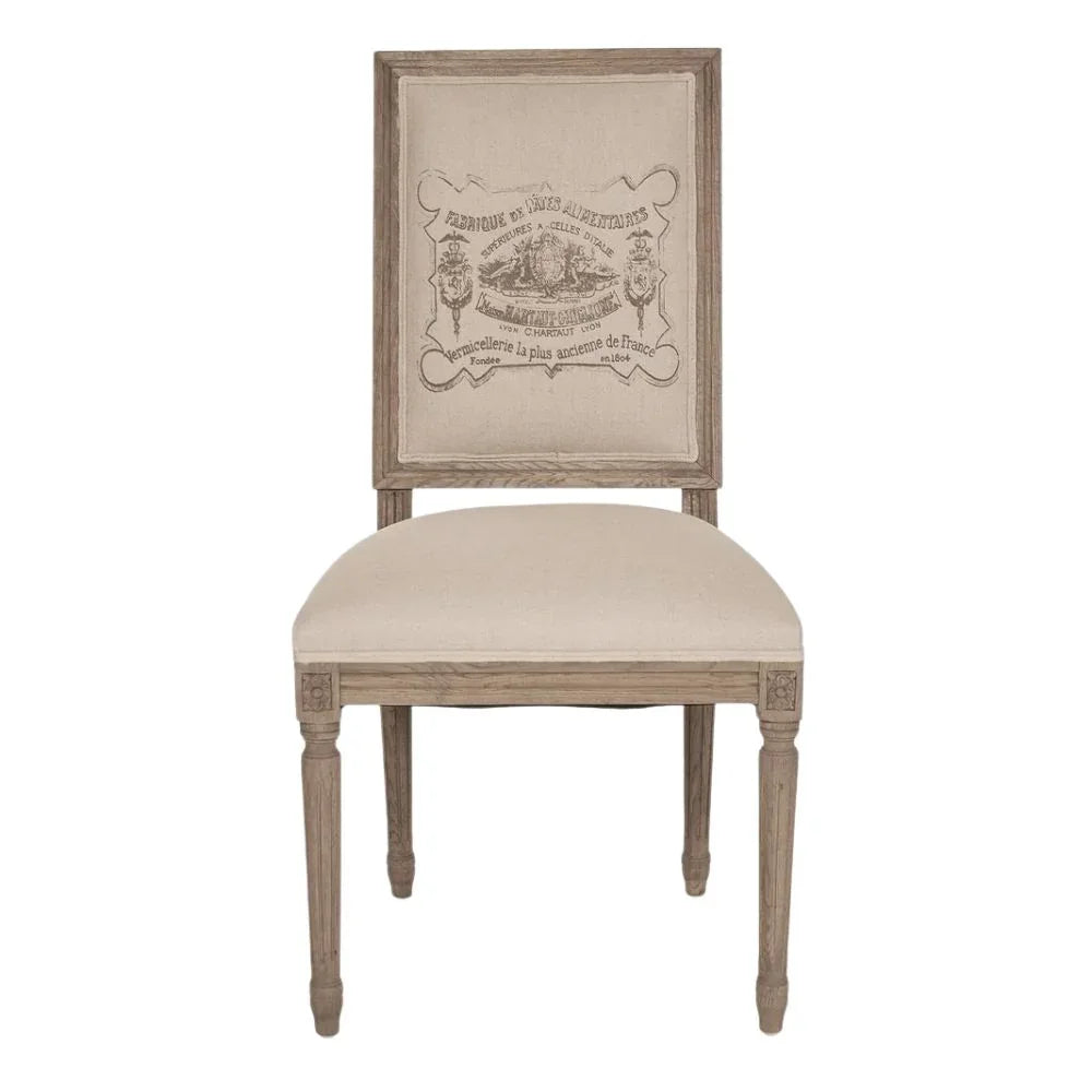 French country dining chair with vintage label print, rustic wood frame, and beige upholstery