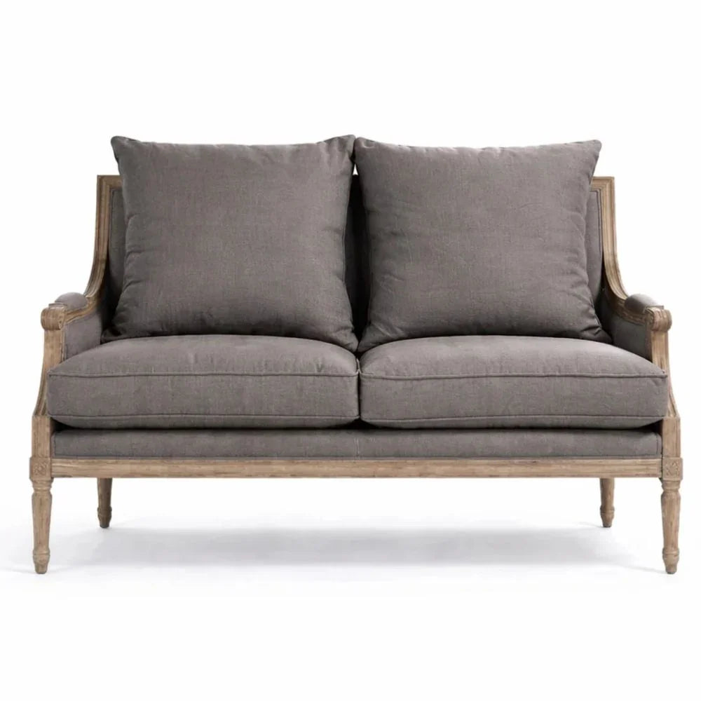 Grey French country loveseat with distressed wood frame and plush cushions