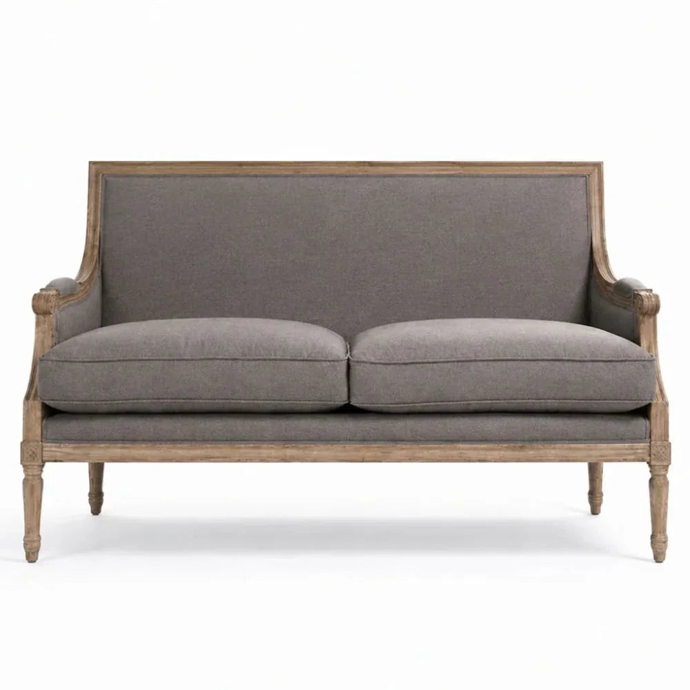 Grey French country sofa with distressed wood frame and classic curved arms