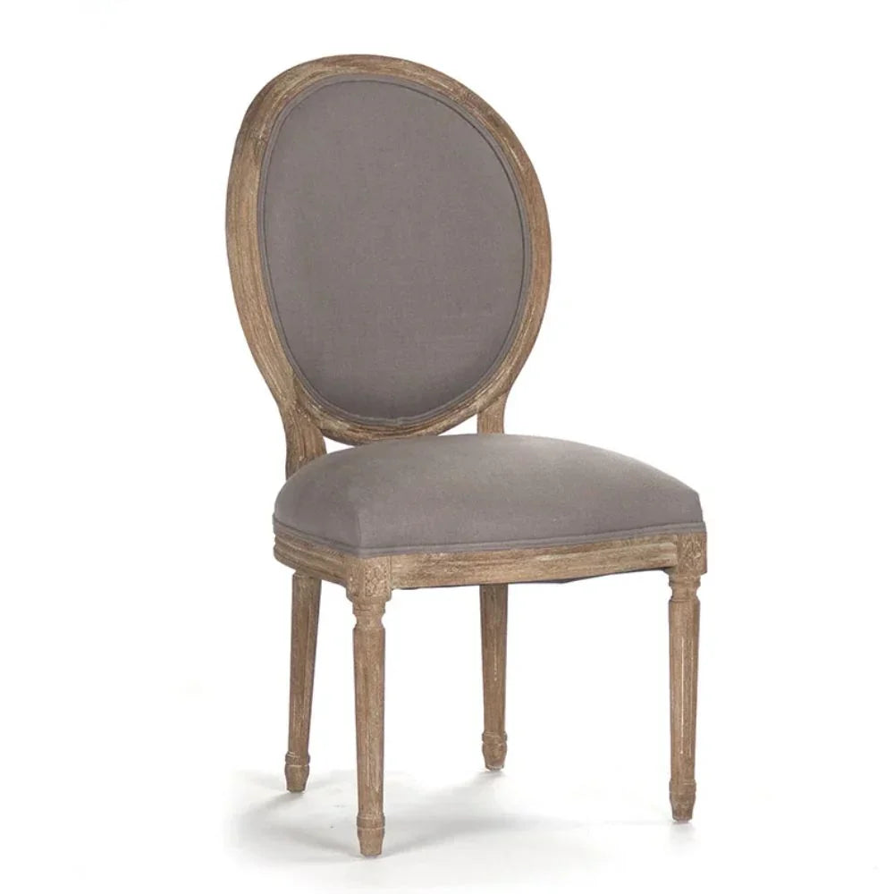 Elegant French country dining chair with gray upholstery and distressed wood frame