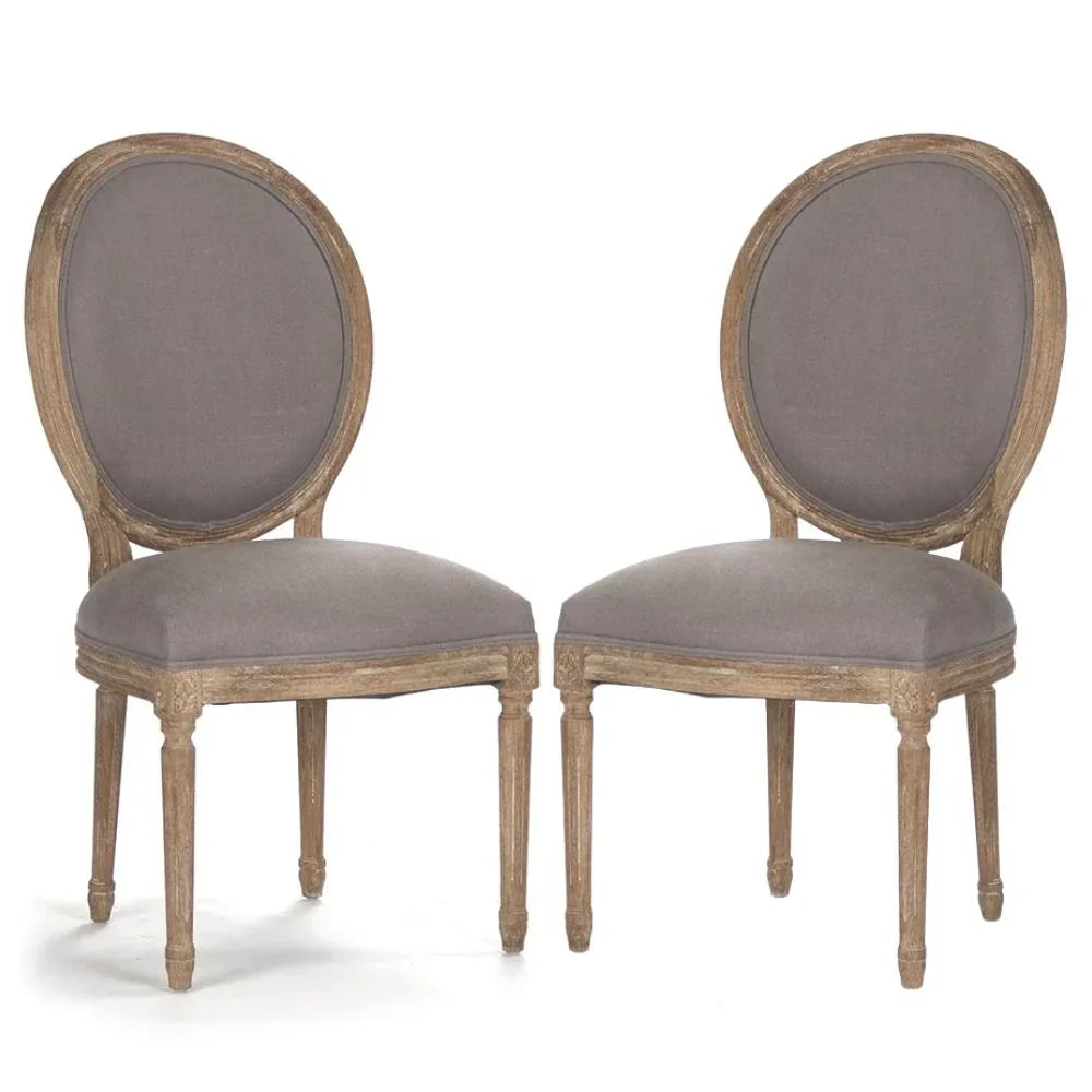 French country dining chairs with oval back, gray upholstery, and distressed wood finish