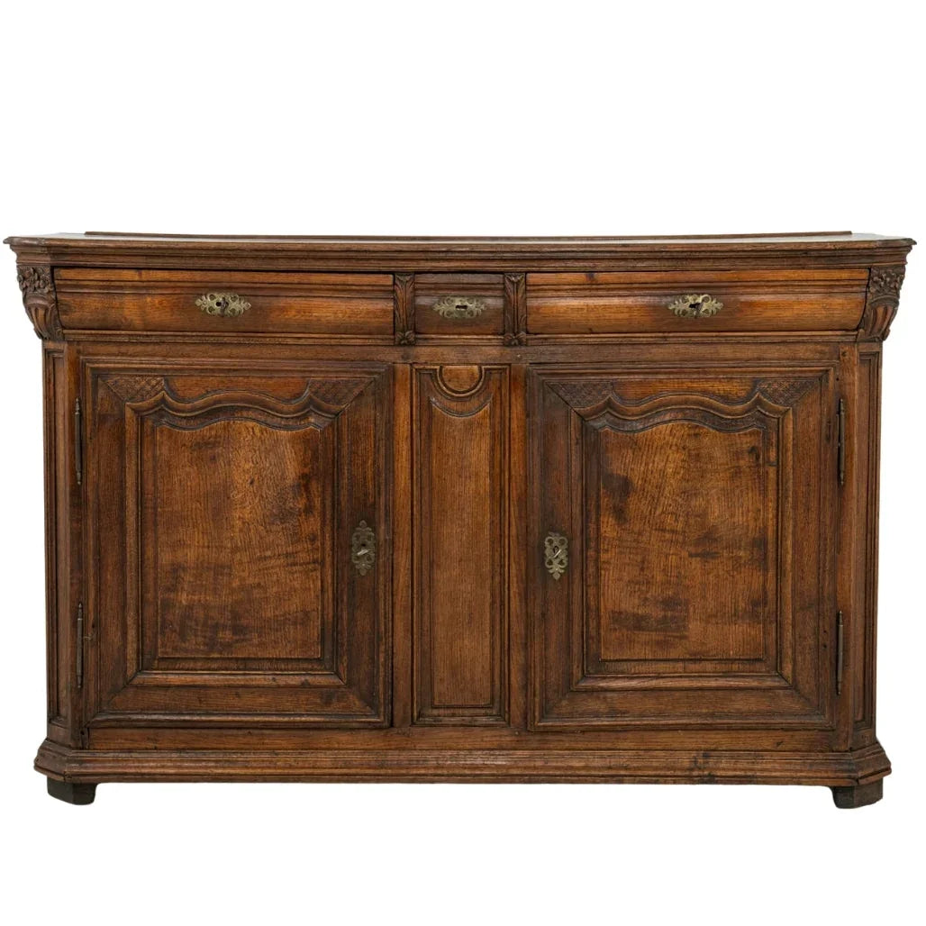 Antique French country sideboard with ornate carvings and brass hardware