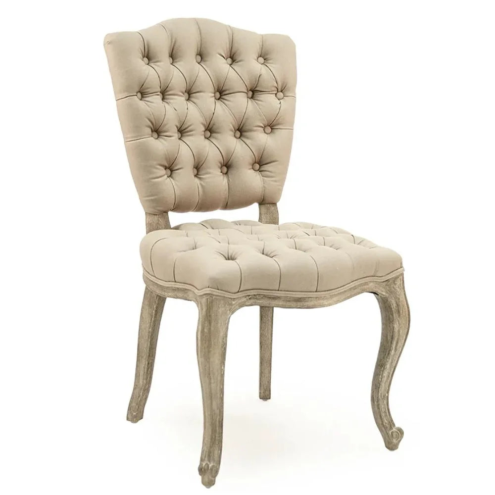 Tufted beige dining chair with distressed wood legs, French country style