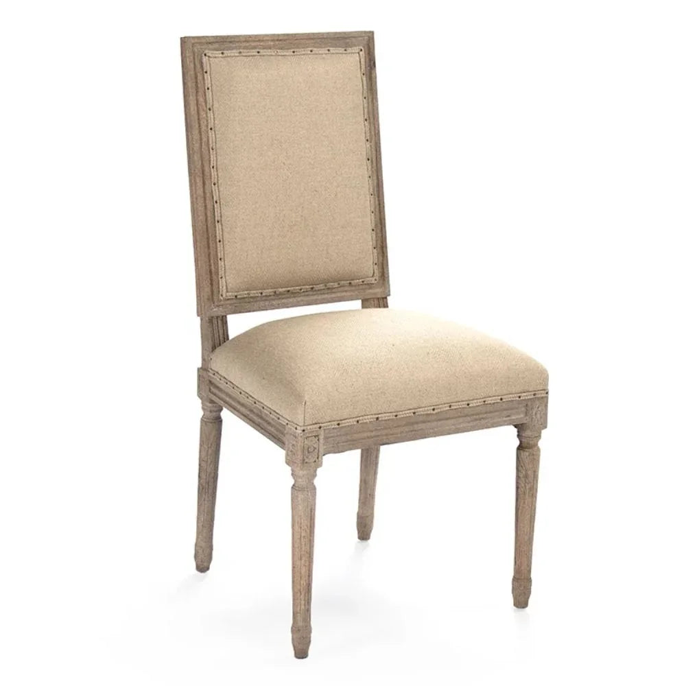 French country dining chair with beige upholstery and nailhead trim, rustic farmhouse style