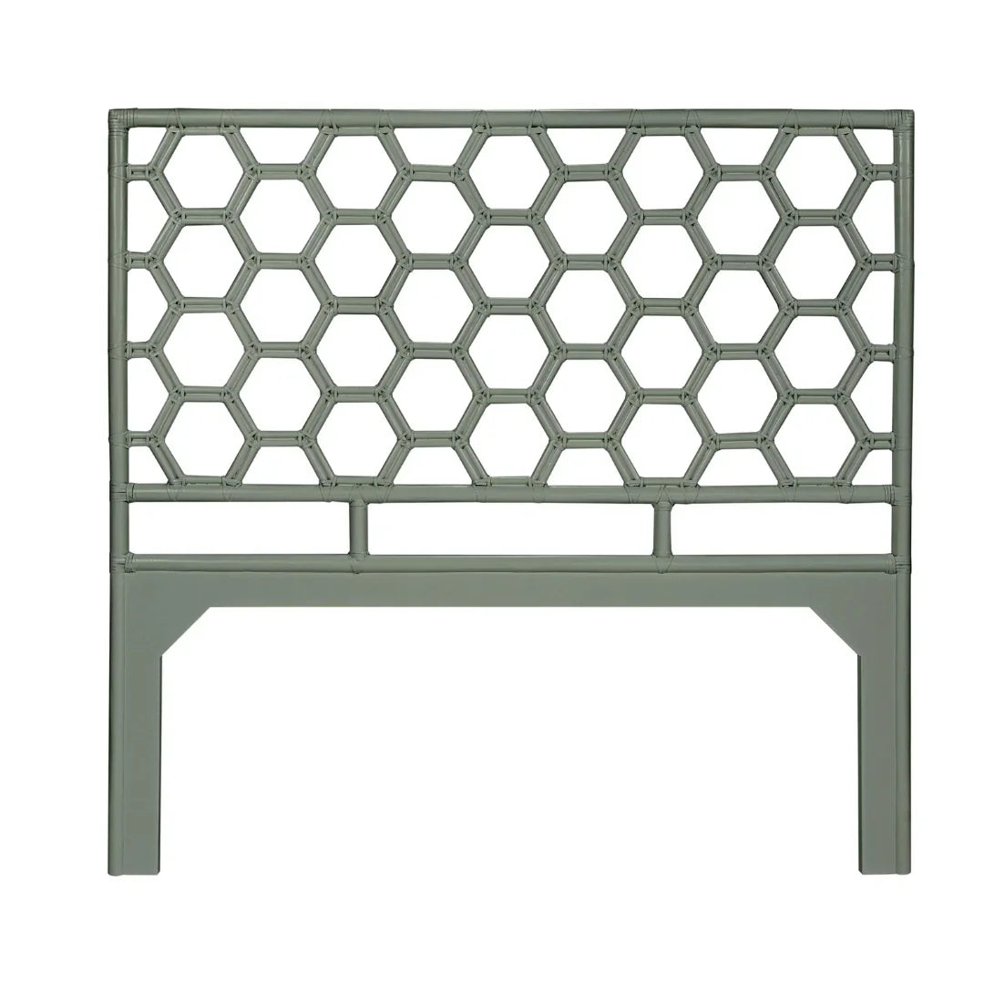 Sage green bamboo-style headboard with a geometric honeycomb lattice design in coastal boho style.