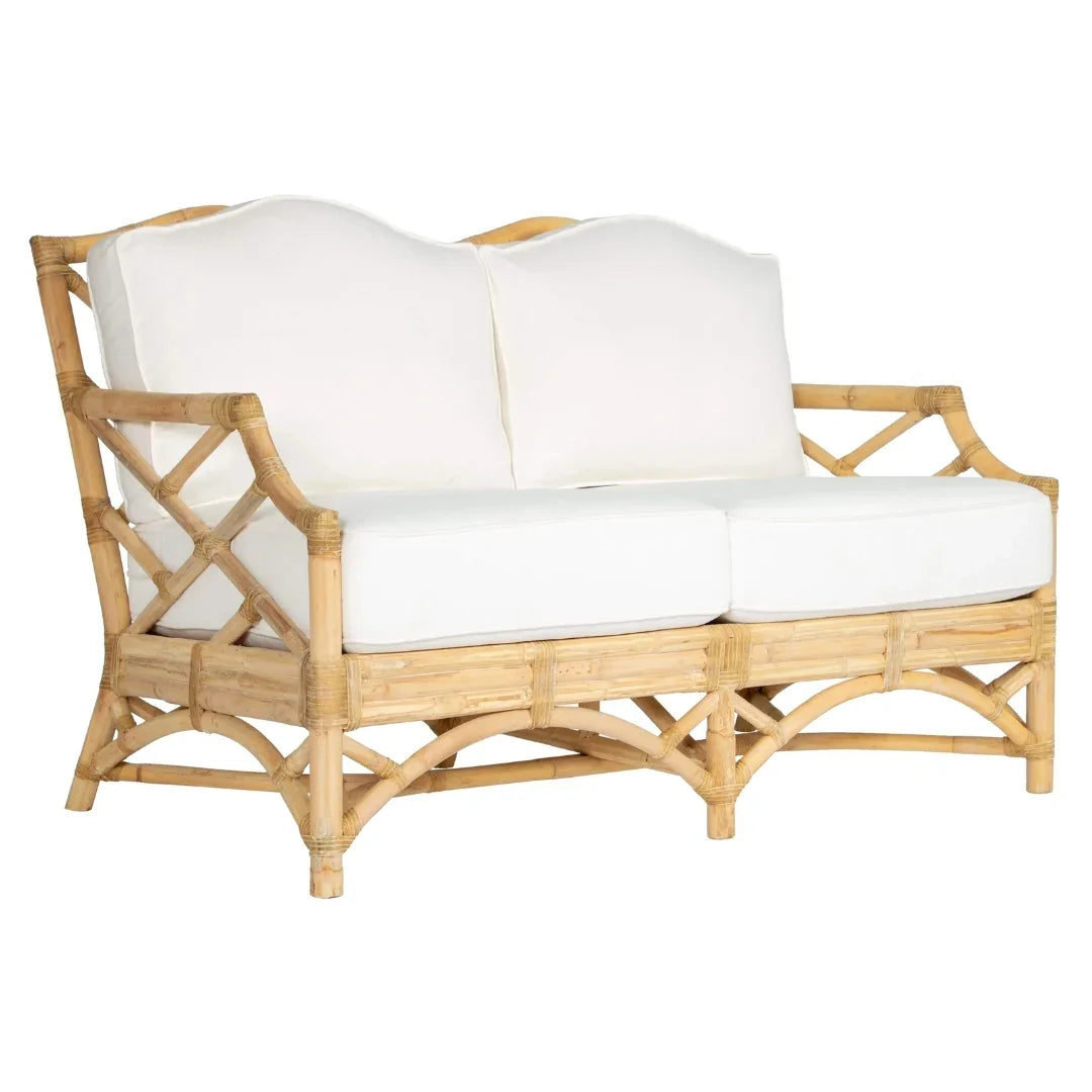 Rattan sofa with white cushions, coastal and boho style furniture