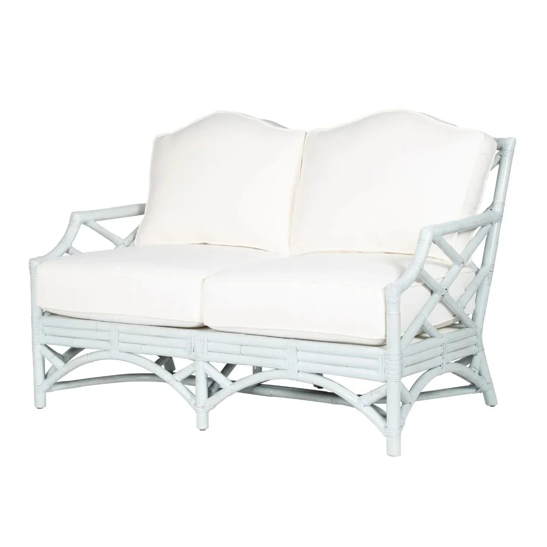 White rattan loveseat with cream cushions, coastal farmhouse style furniture
