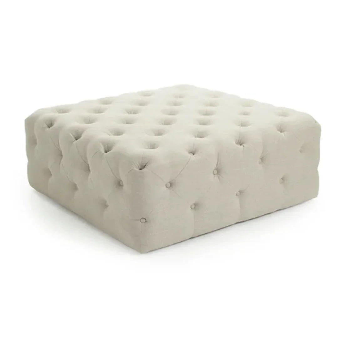 Beige tufted ottoman in farmhouse style with button detailing