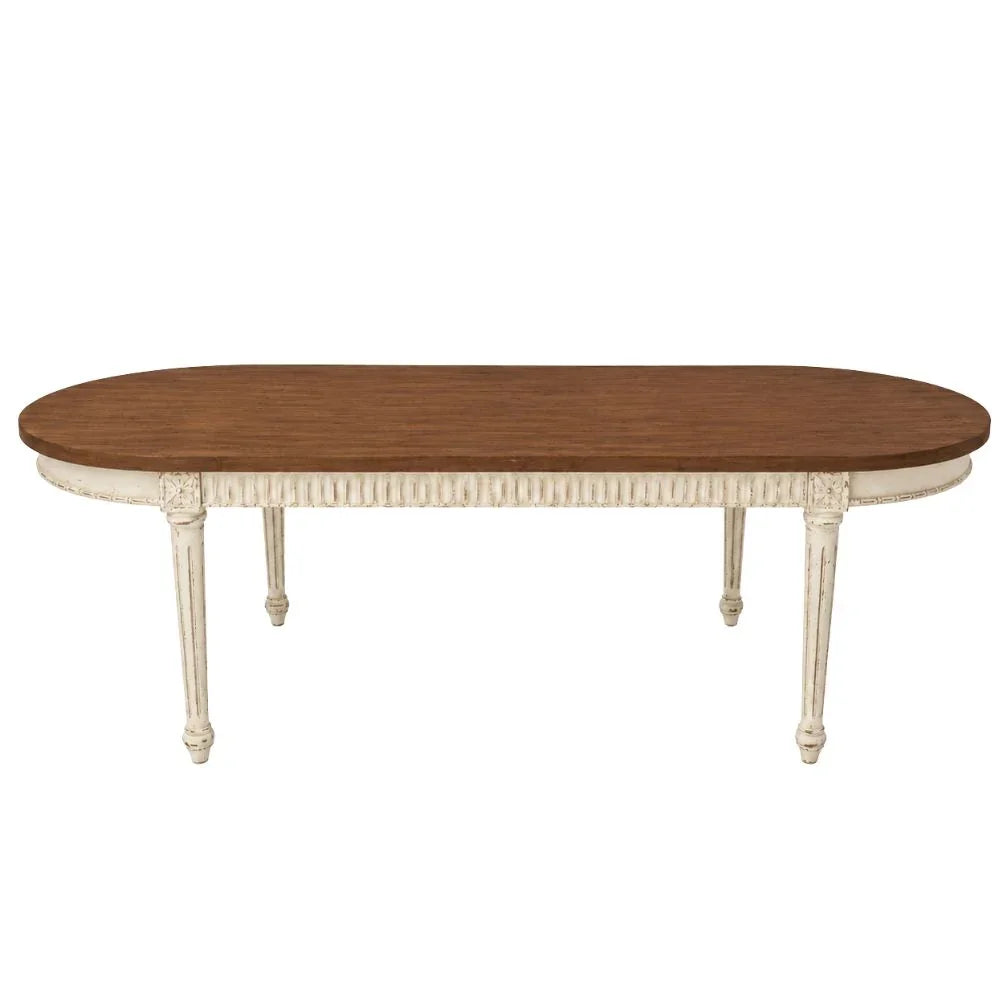 Elegant oval dining table with distressed white base and natural wood top, French country style