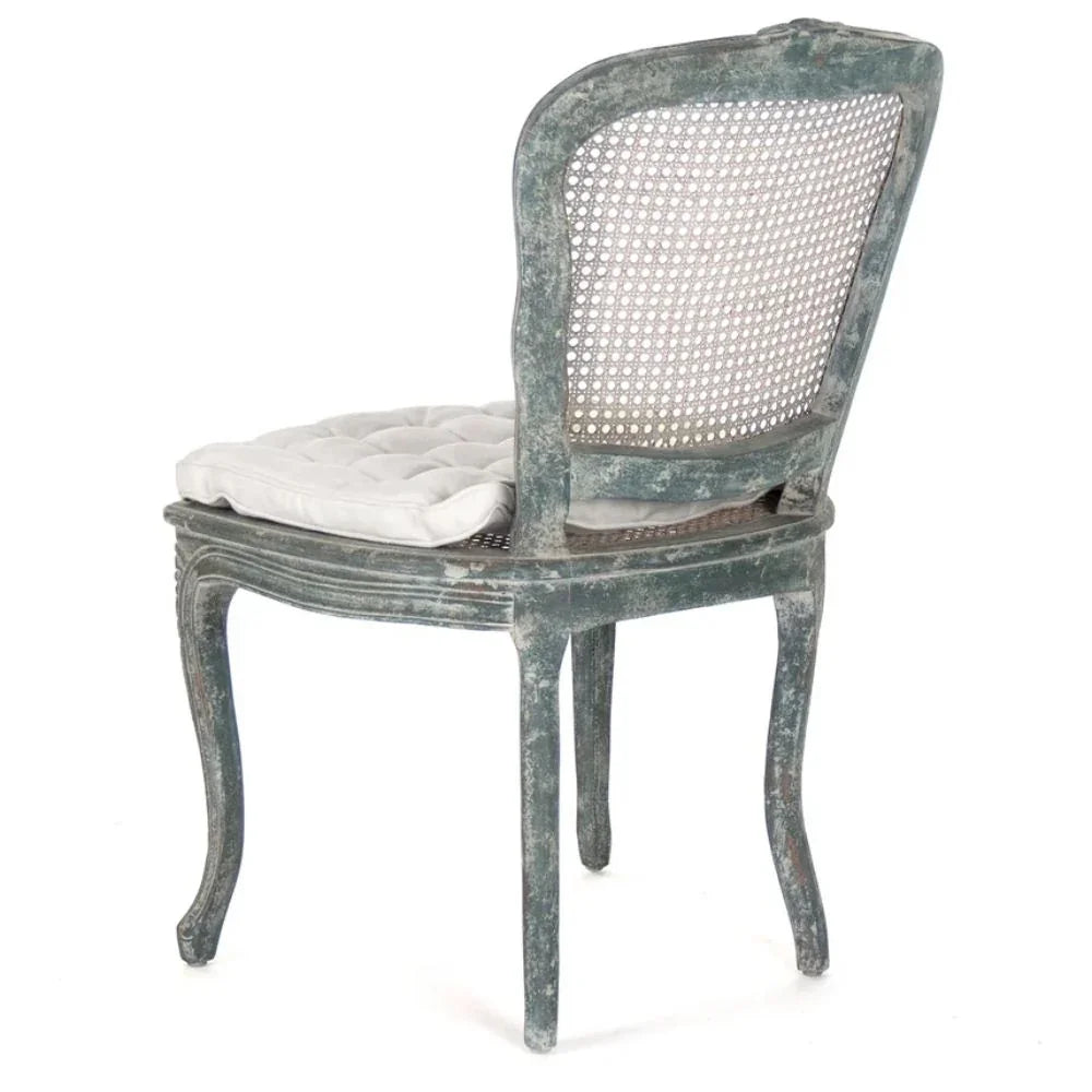 Vintage French country cane chair with distressed green finish and white cushion