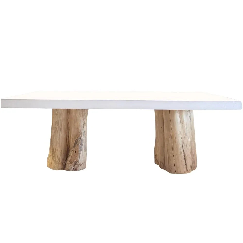 White rustic dining table with natural wood stump legs, perfect for farmhouse or boho interiors