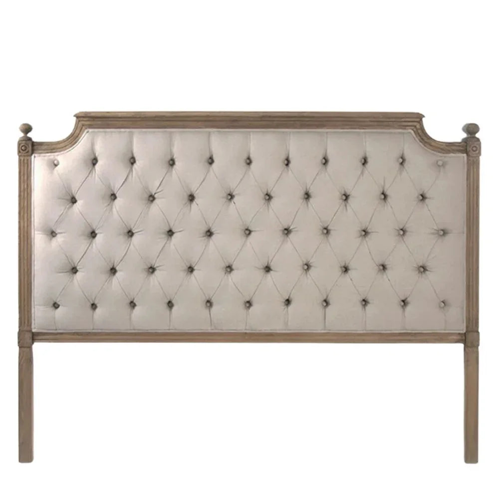 French country tufted headboard with distressed wood frame and cream upholstery