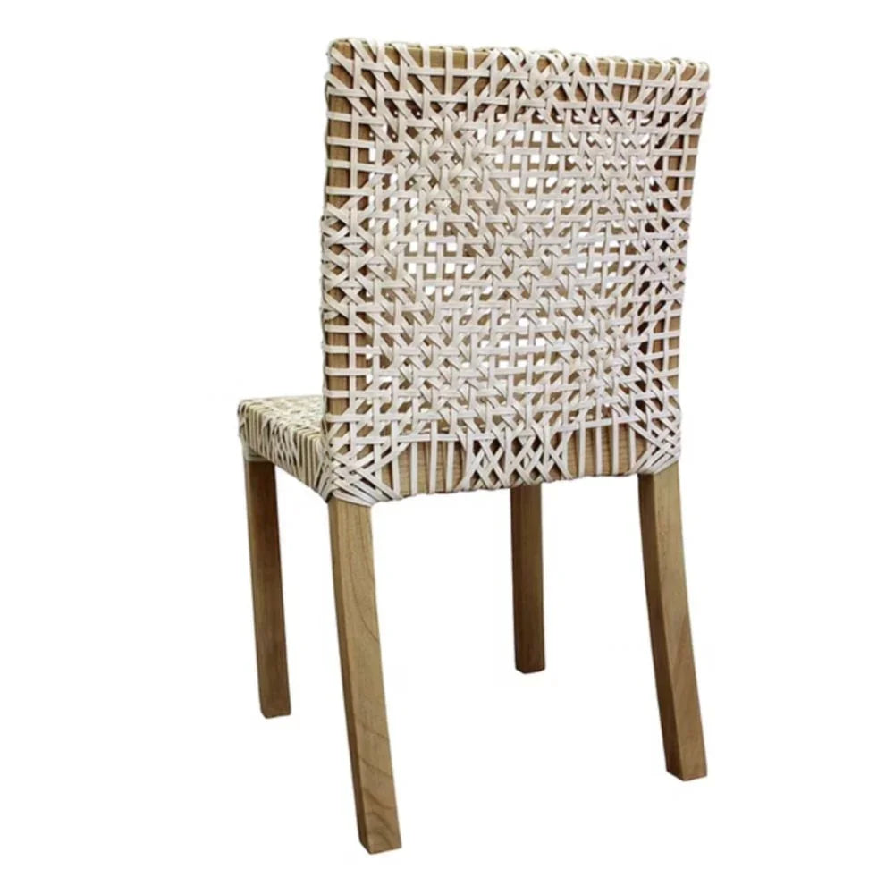Woven rattan dining chair with natural wood legs, coastal boho style