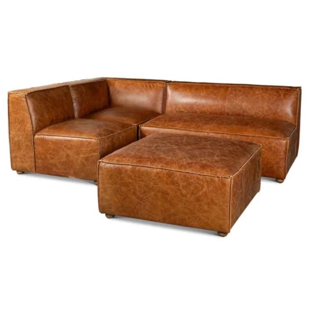 Brown leather sectional sofa with matching ottoman, rustic farmhouse style