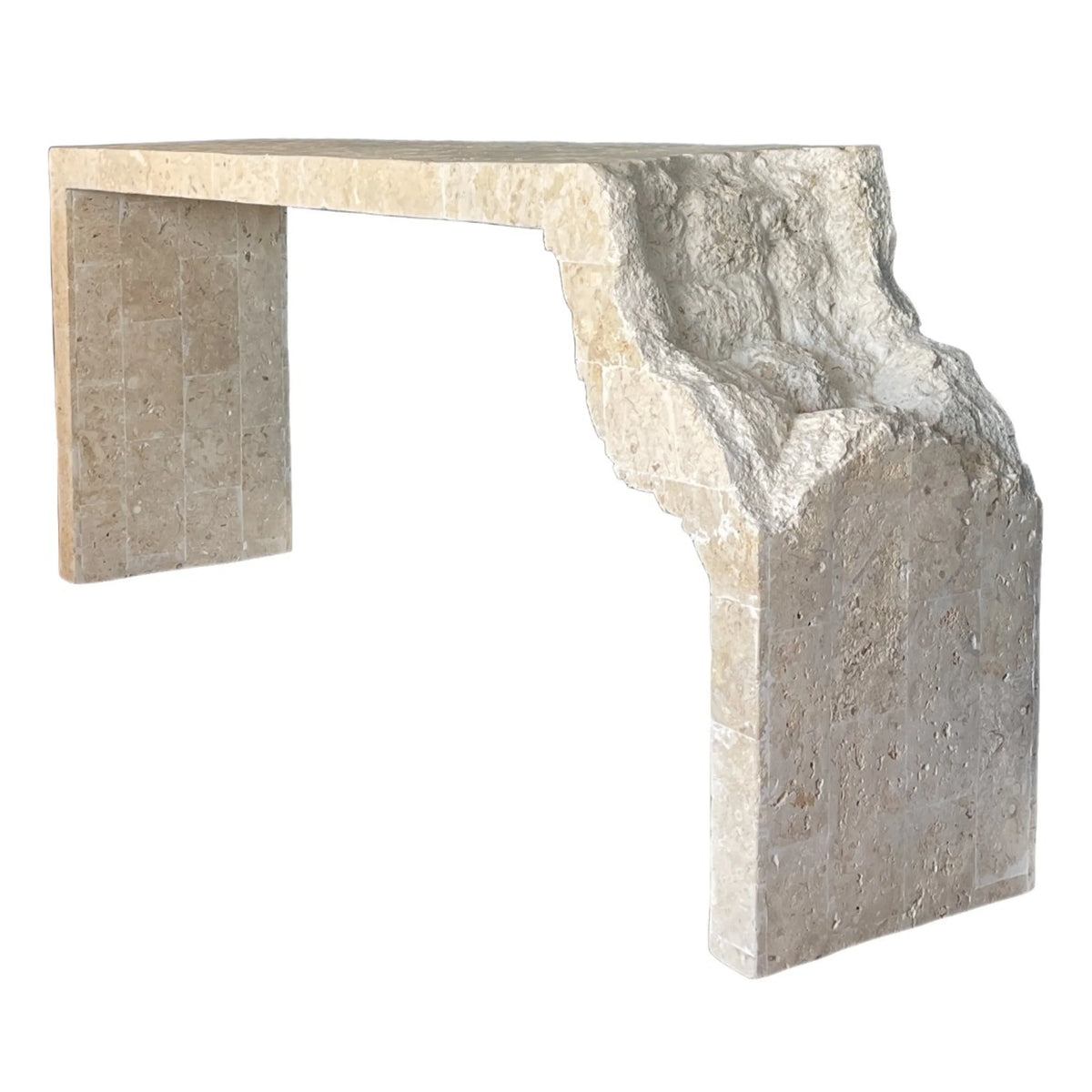 Natural beige travertine stone console table with a raw, organic carved edge in a boho style.