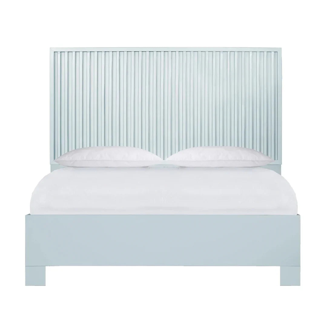 Light blue slatted headboard bed frame in a coastal farmhouse style with white bedding.