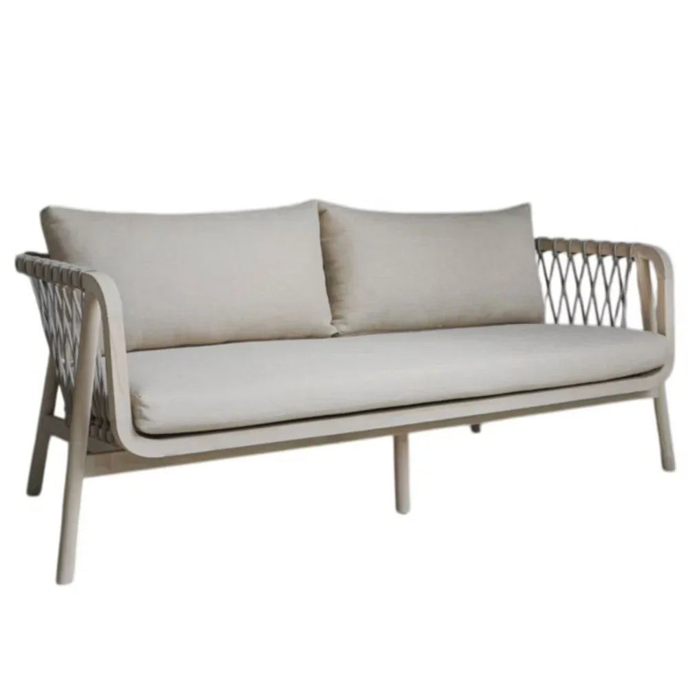 Coastal style sofa with light grey cushions and woven rope detail frame.