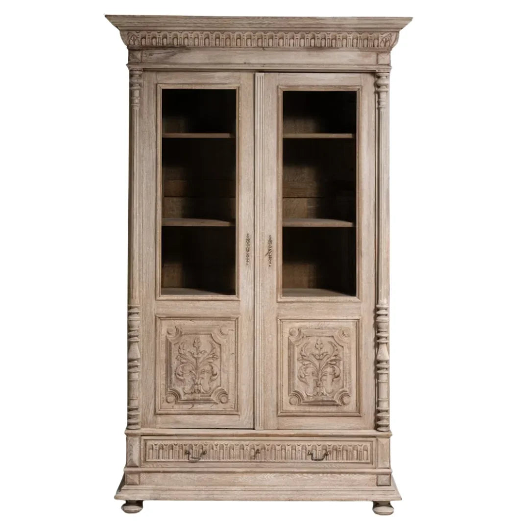 French country style weathered wood armoire with glass doors and carved floral panels