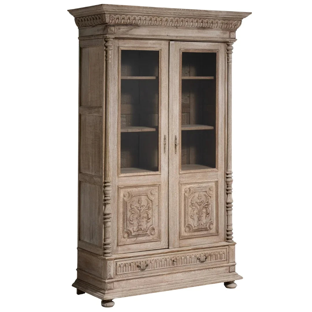 French country style weathered wood display cabinet with glass doors and carved details