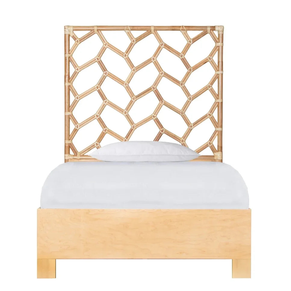 Natural boho rattan bed with a geometric open-weave headboard and light wood frame.