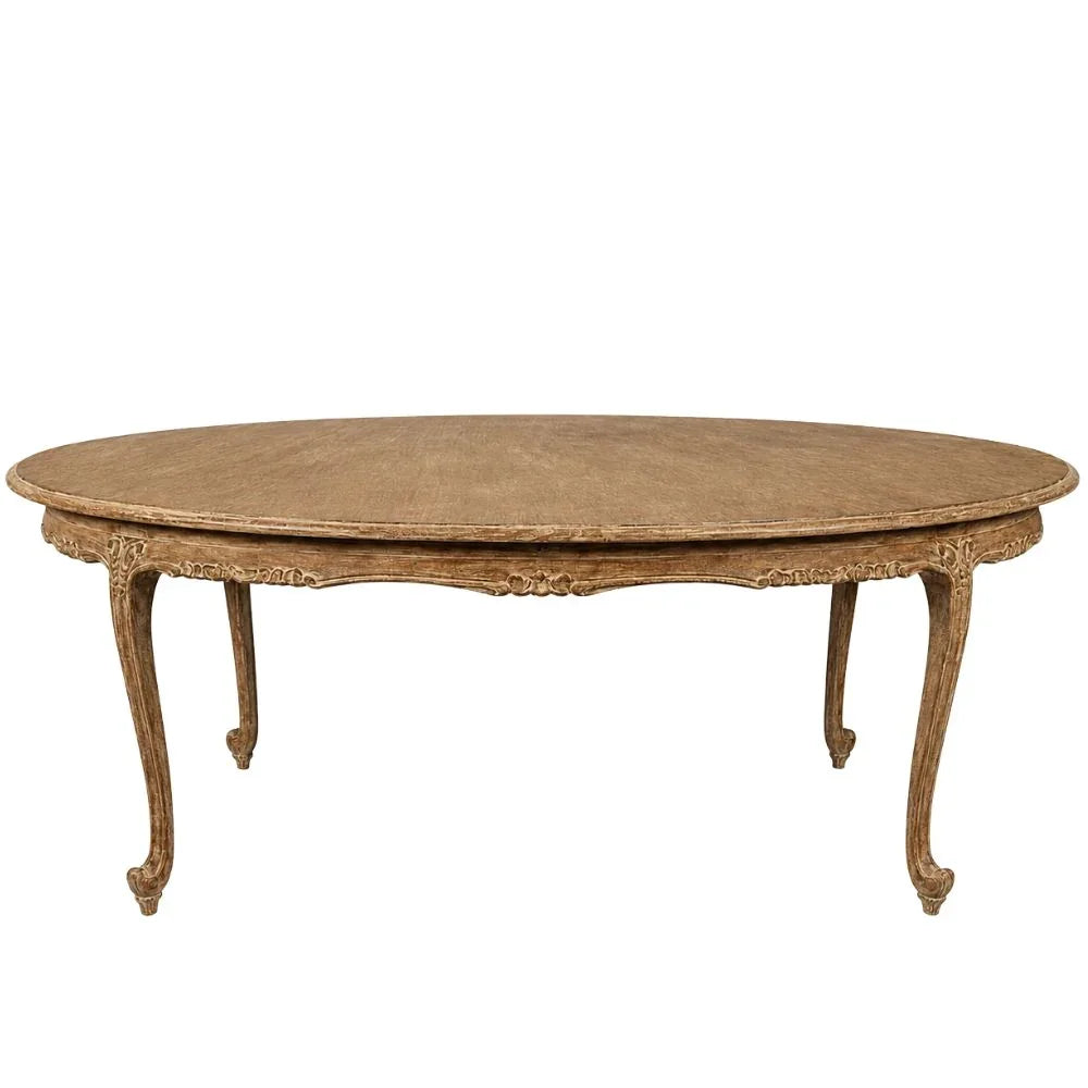 French Dejeuner dining table with cabriole legs, ornate carvings on the apron, and a weathered wood finish, perfect for French country interiors