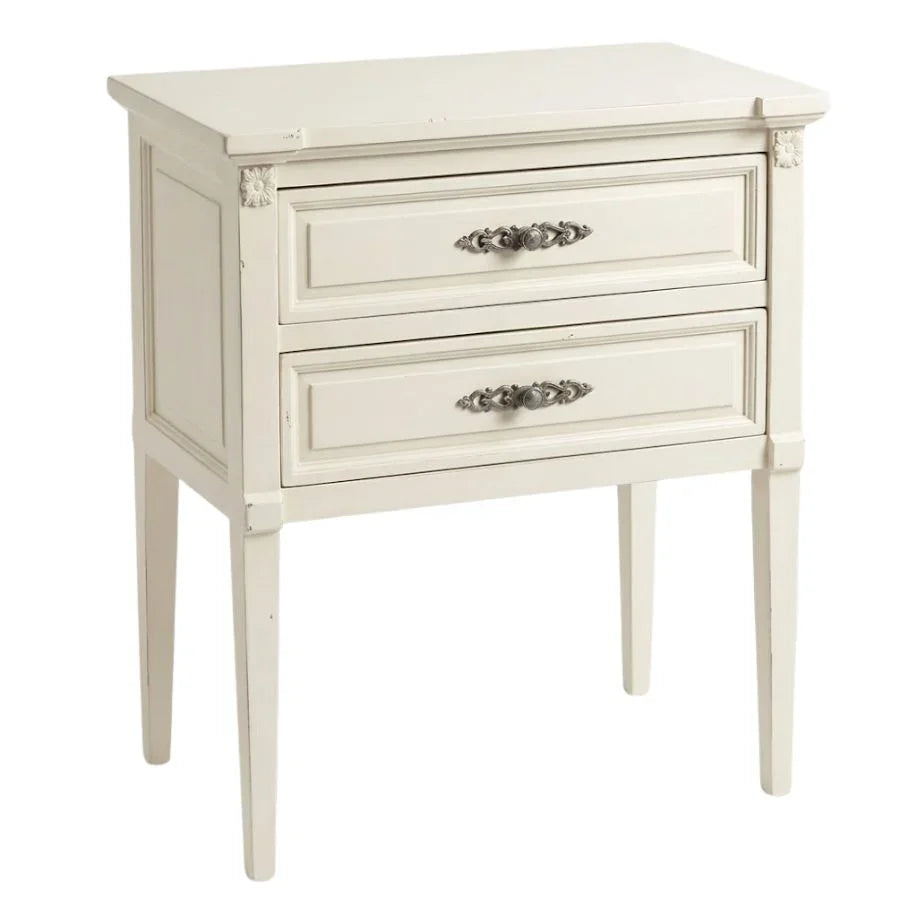 Off-white French country nightstand with two drawers and ornate silver handles.