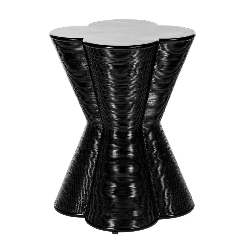 Black hourglass shaped ribbed accent side table with a flower-shaped top.