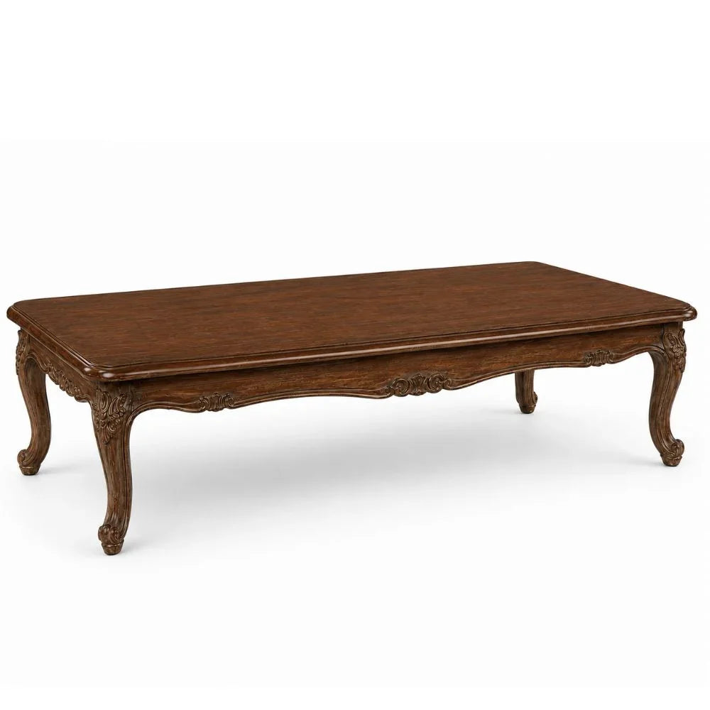 Elegant French country coffee table with carved legs and rich wood finish