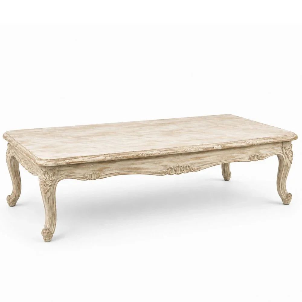 Elegant French country coffee table with ornate carvings and distressed finish, perfect for shabby chic or farmhouse decor.