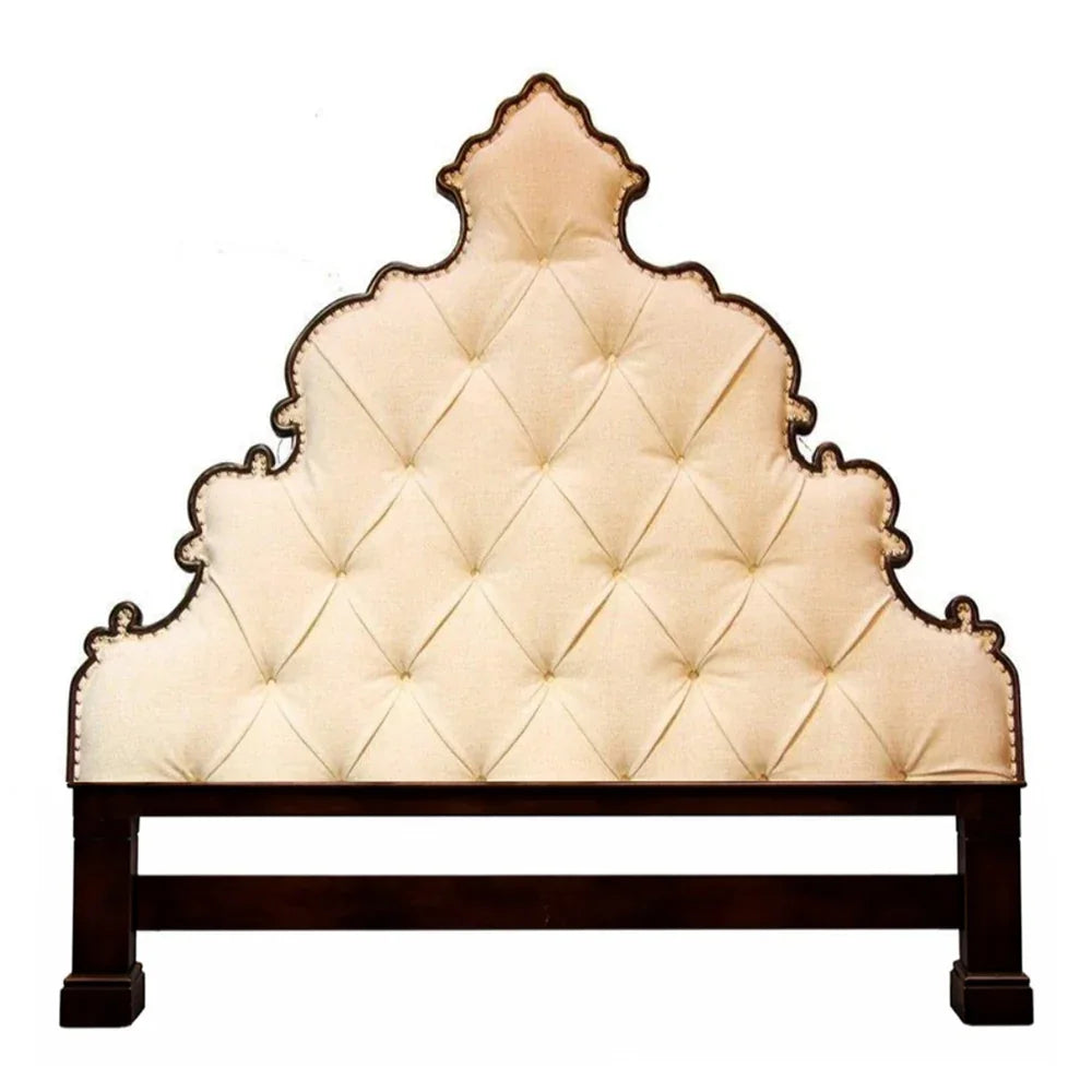 Elegant tufted headboard with scalloped edges, French country style, cream upholstery, dark wood frame