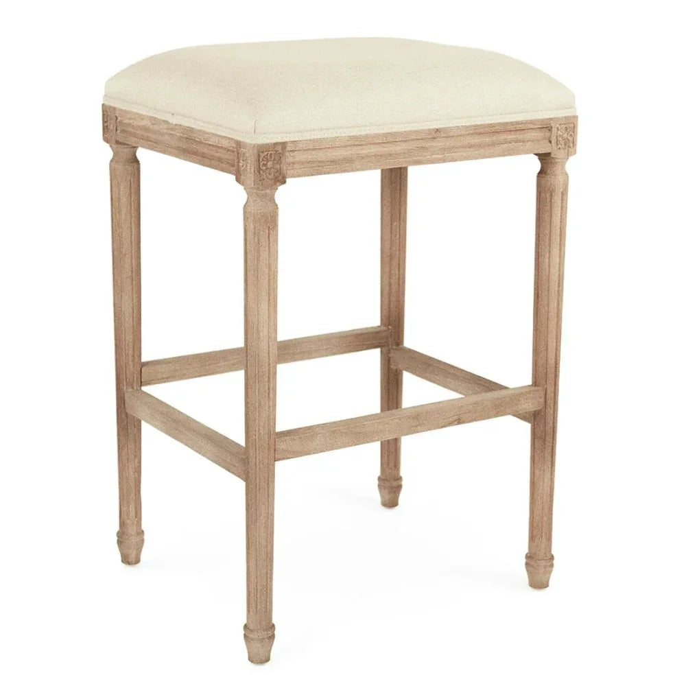 French country bar stool with cream upholstered seat and carved wood legs