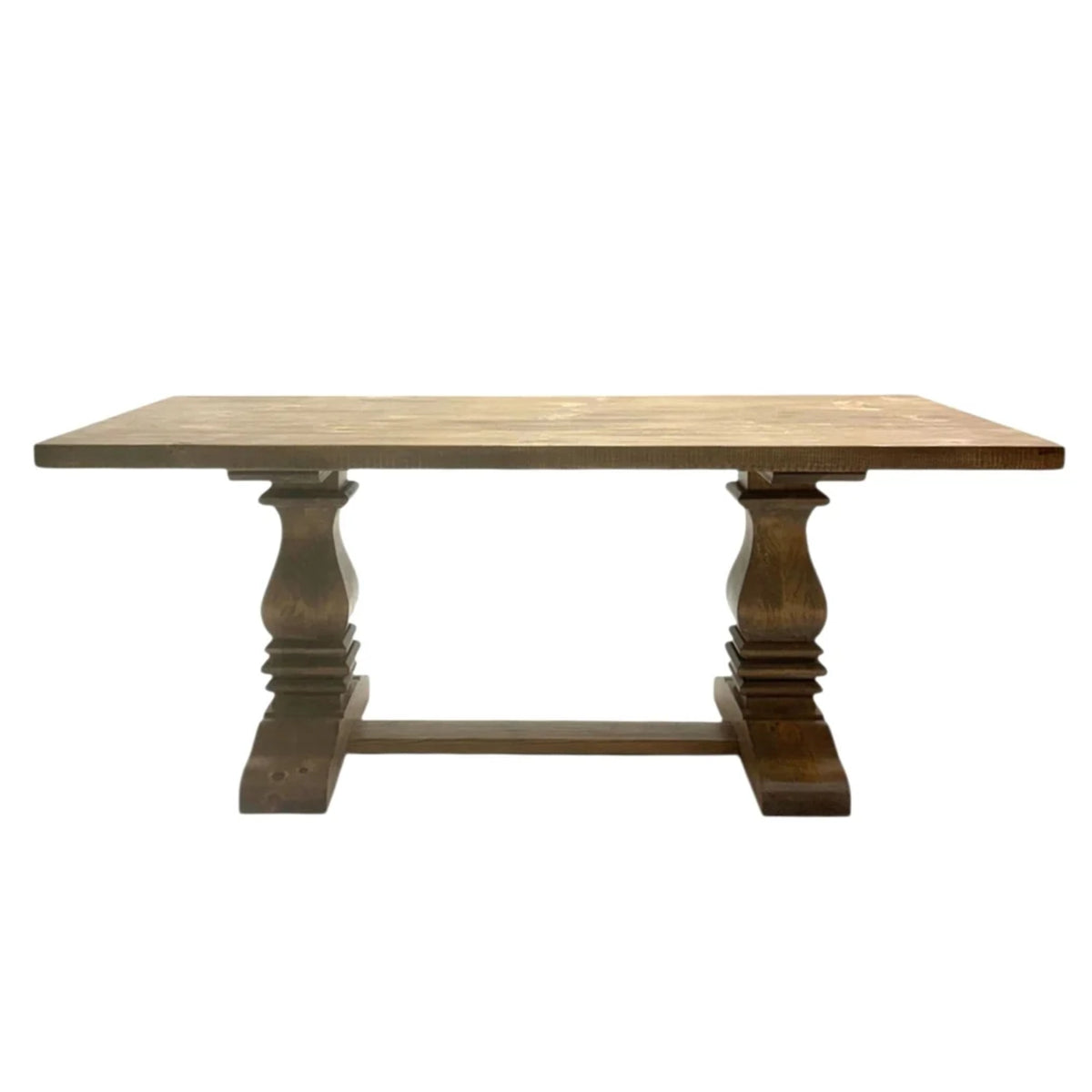 Rustic French country dining table with distressed wood finish, sculpted pedestal legs, and sturdy trestle base.