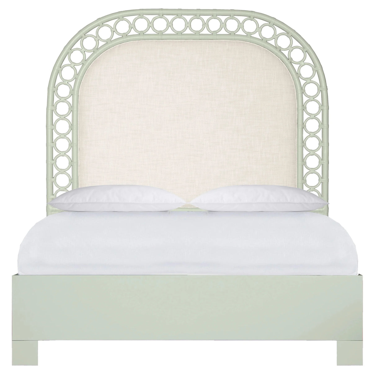 Pale green arched headboard bed with cream fabric panel and coastal cane-style frame