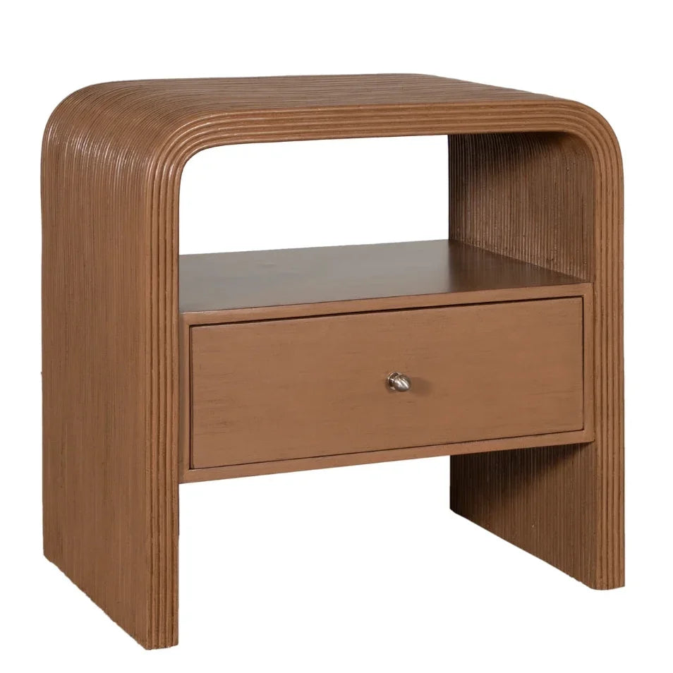 Brown fluted wood nightstand with a single drawer in a modern boho style.