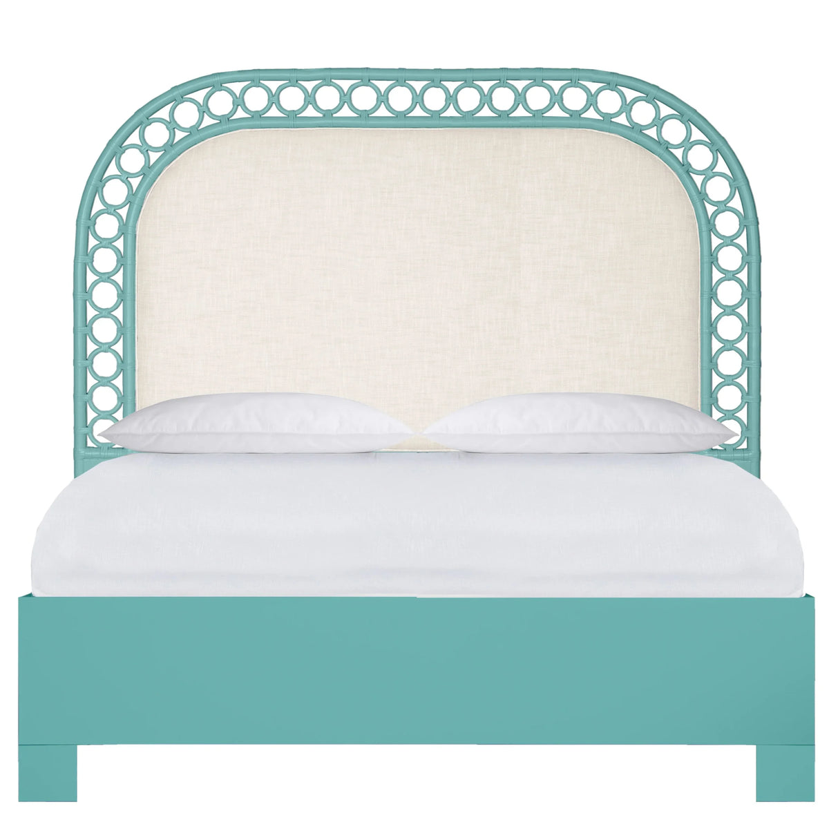 Coastal style teal bed with a bamboo-style curved headboard and cream upholstery.