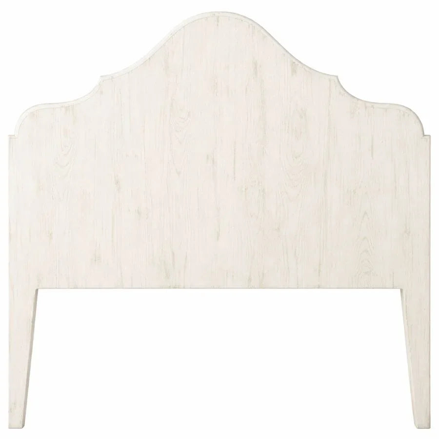 White distressed wood headboard with curved top, French country farmhouse style