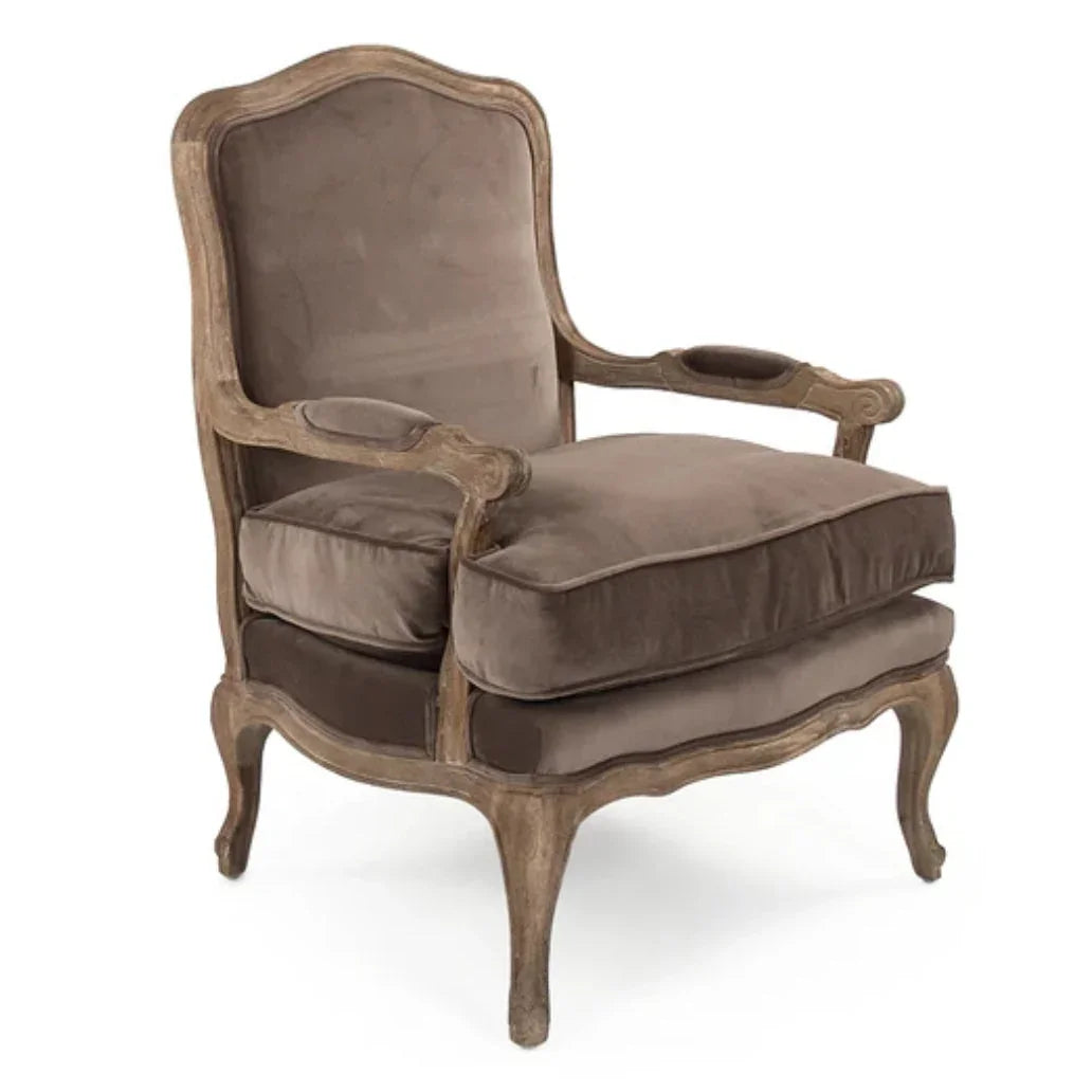 French country armchair with velvet upholstery and carved wood frame