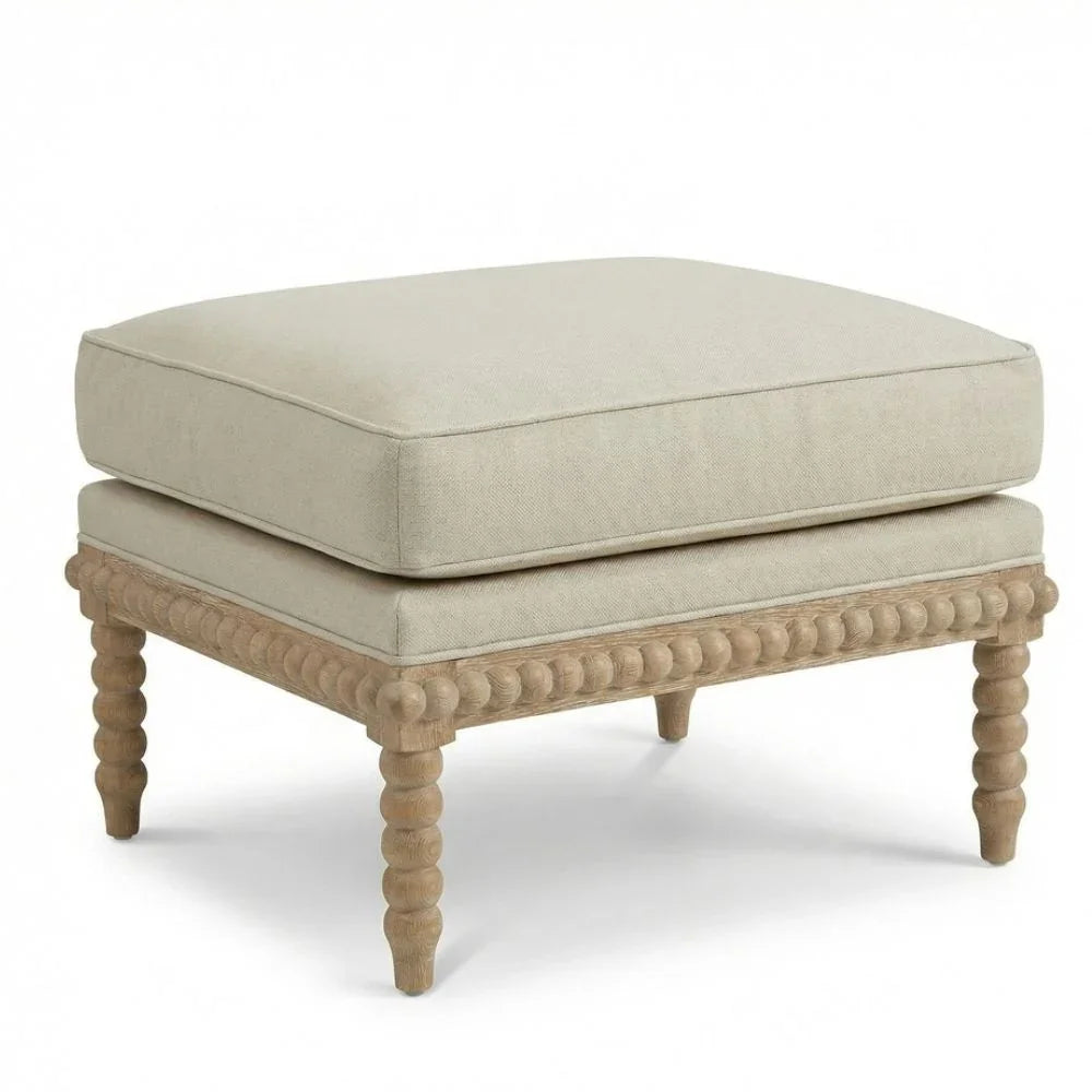 Beige upholstered ottoman with carved wooden legs, French country style accent furniture