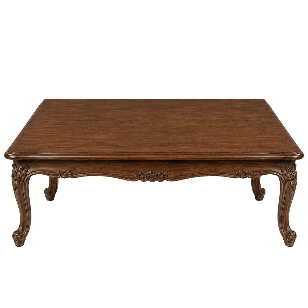 Elegant French country coffee table with ornate carvings and rich wood finish