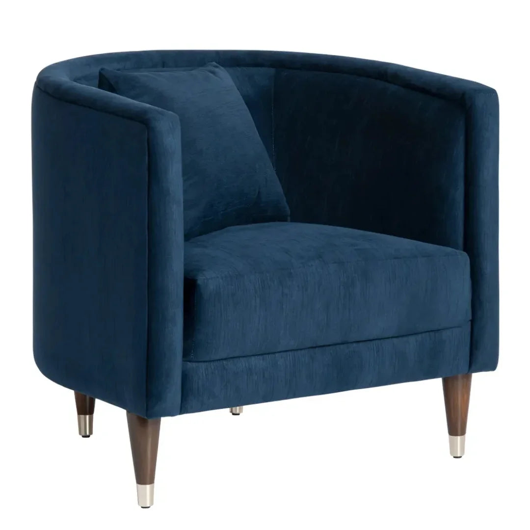 Navy blue velvet armchair with wooden legs and metal caps, perfect for cozy living room decor