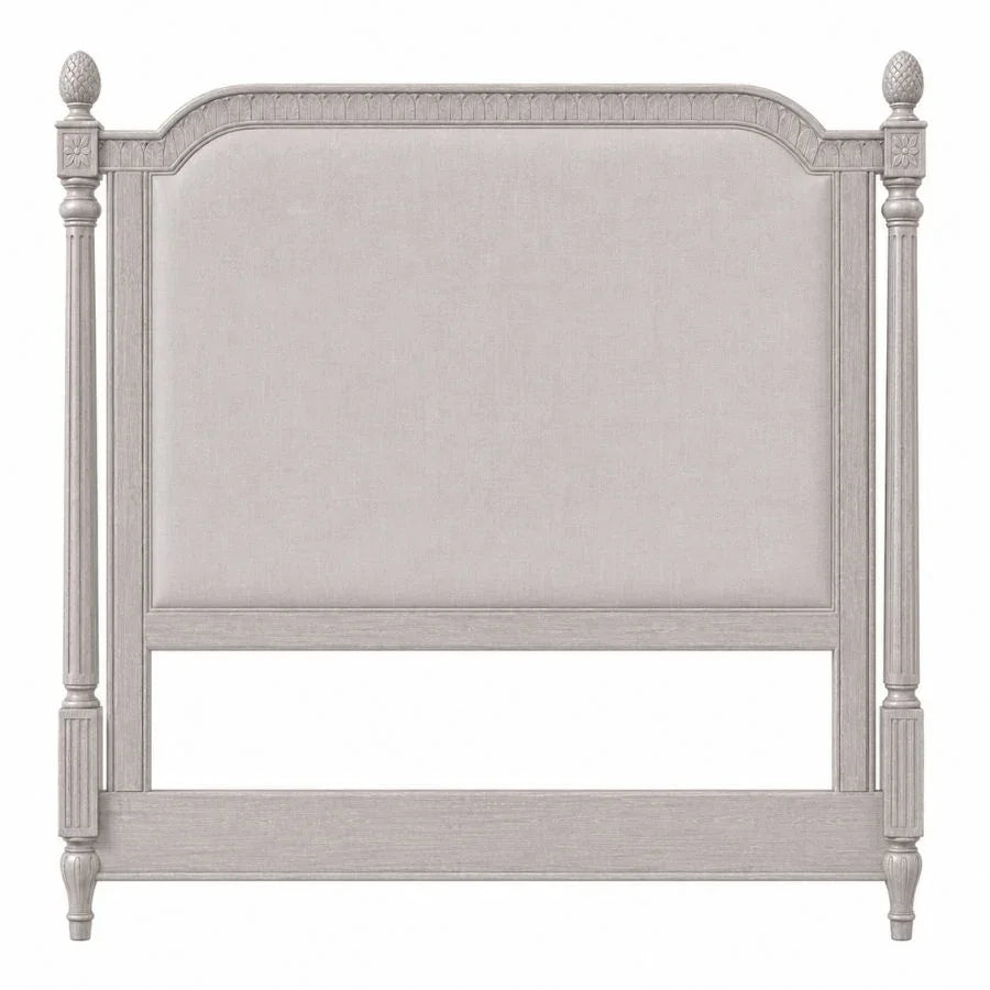 French country style upholstered headboard in light grey with carved pineapple posts