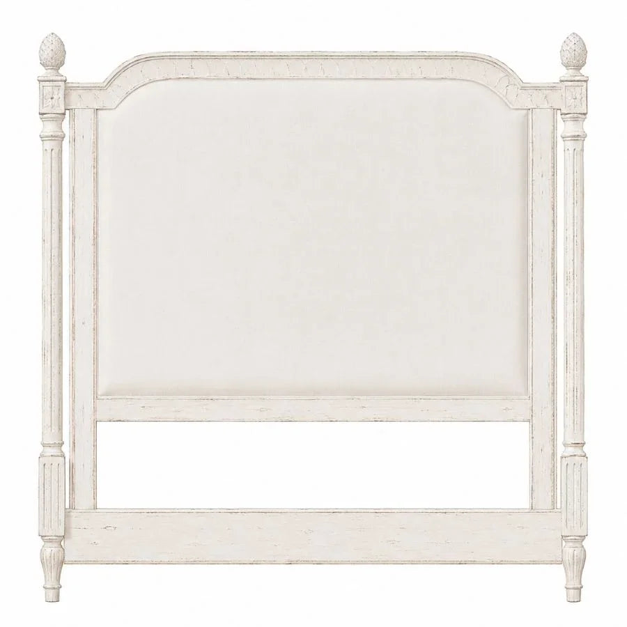 White French country style upholstered headboard with distressed wood frame and finials.