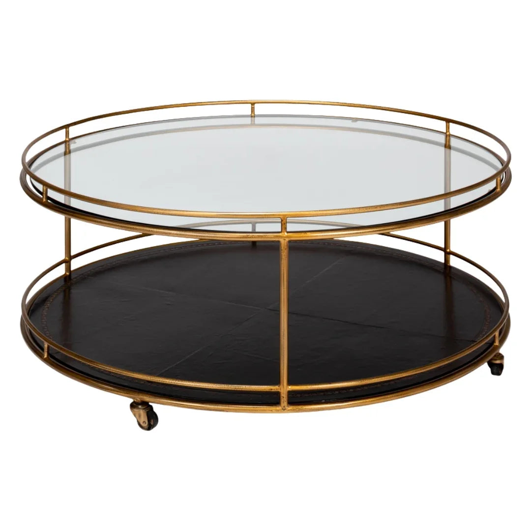 Round gold metal coffee table with glass top and black lower shelf in French country style