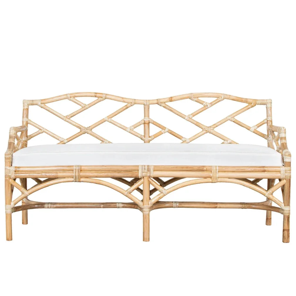 Natural boho rattan bench with white cushion and intricate woven back design.