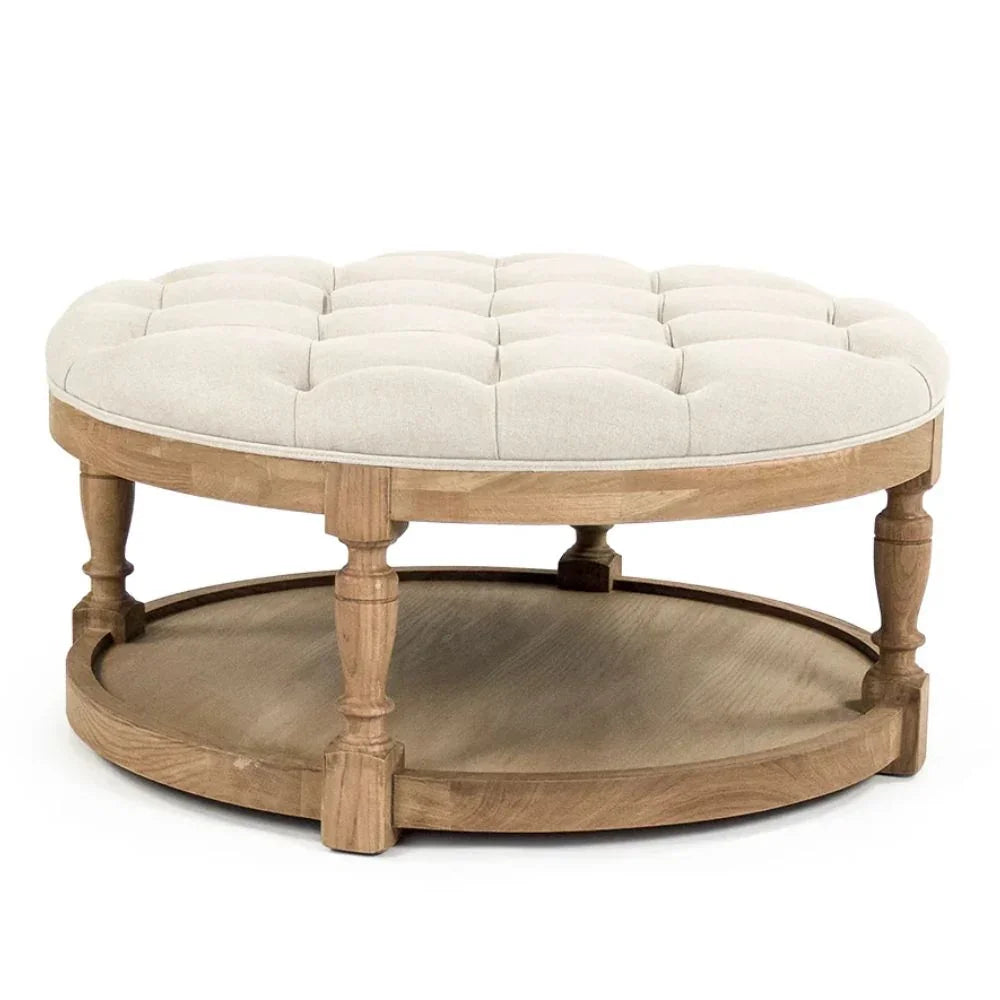Round tufted ottoman with wooden base and lower shelf, French country style
